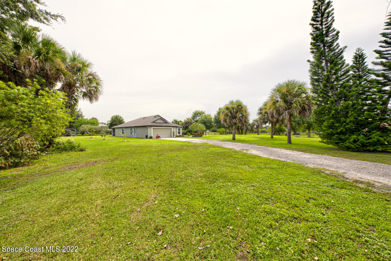 3945 Post Road Melbourne, FL 32934 - Photo 22 of 24 a view of a green field with trees