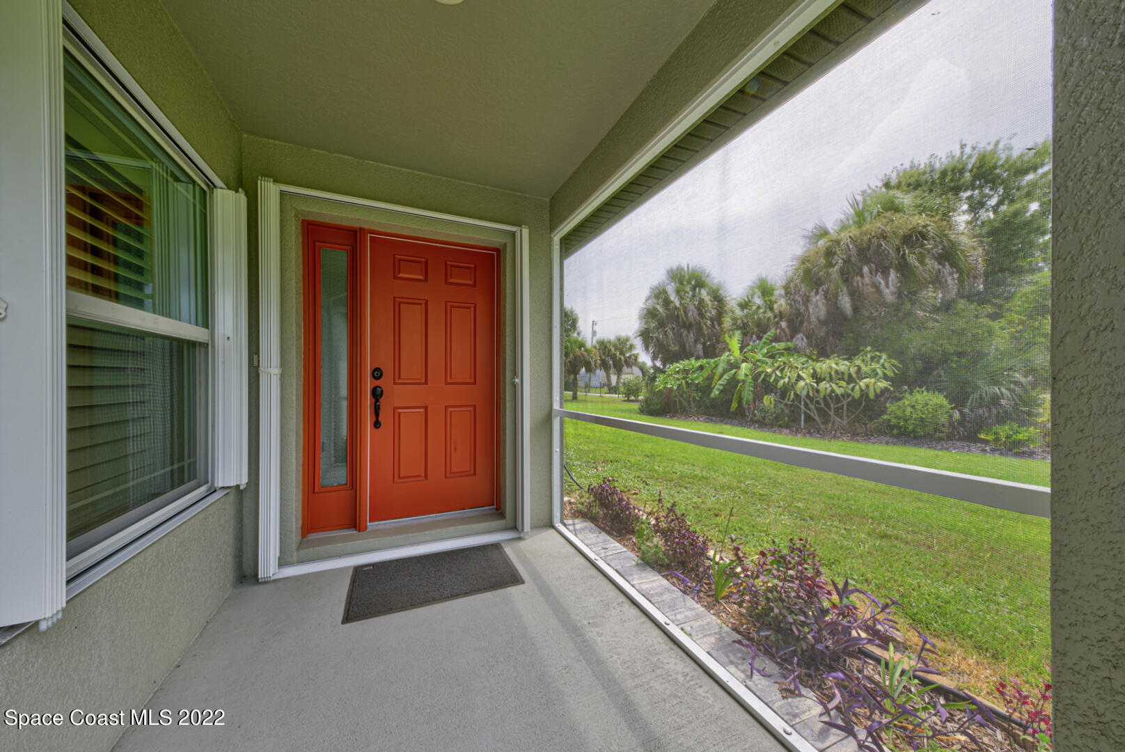 3945 Post Road Melbourne, FL 32934 - Photo 5 of 24 a view of backyard with large trees and plants