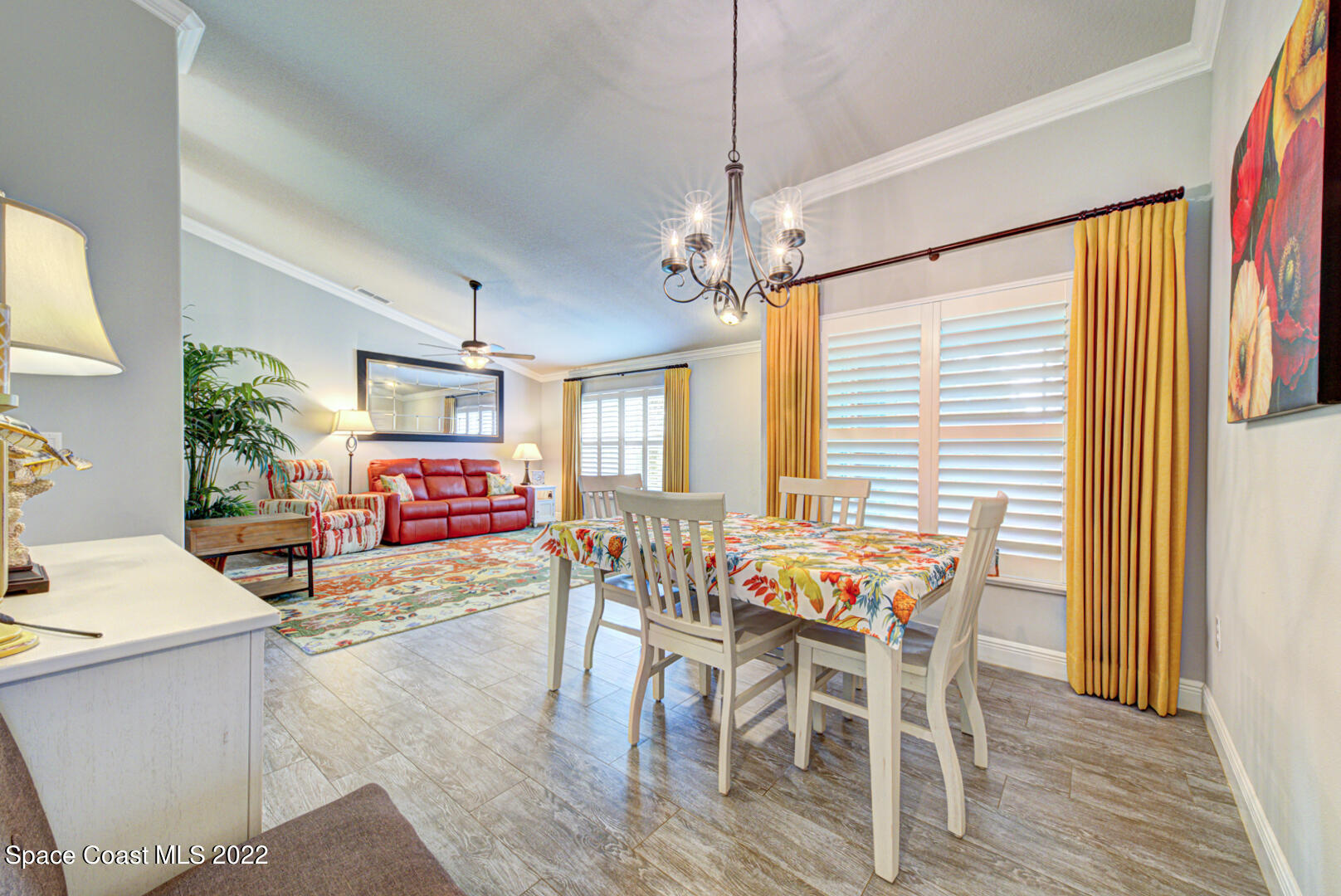 3945 Post Road Melbourne, FL 32934 - Photo 6 of 24 a view of a dining room with furniture window and wooden floor