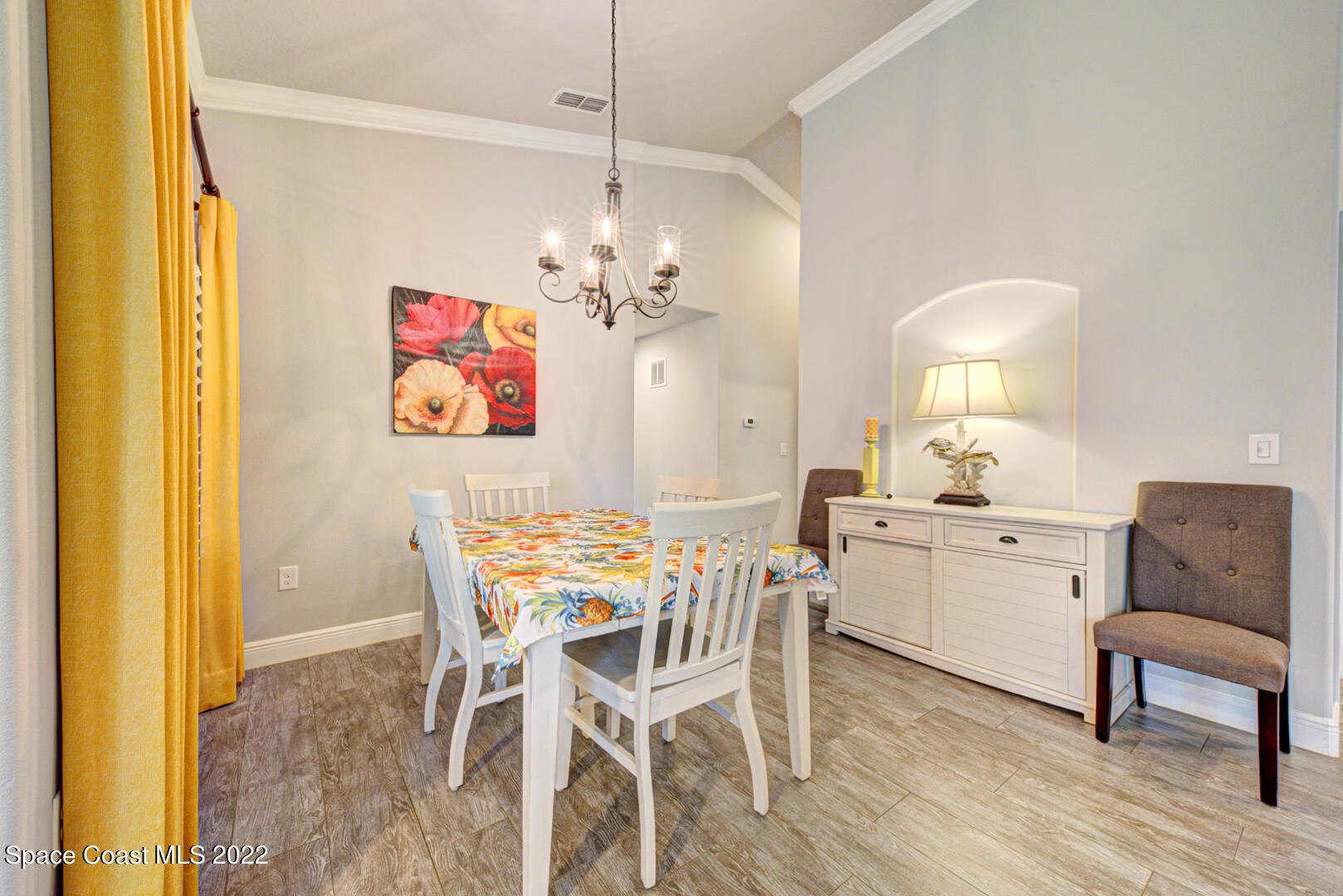 3945 Post Road Melbourne, FL 32934 - Photo 7 of 24 a view of a dining room with furniture and chandelier