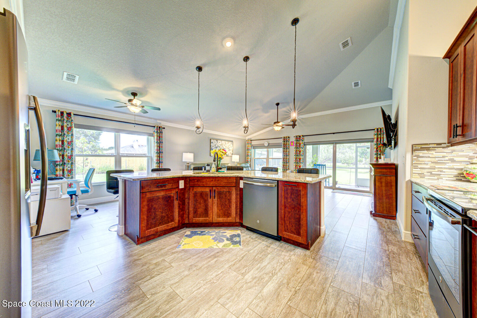 3945 Post Road Melbourne, FL 32934 - Photo 8 of 24 a open kitchen with stainless steel appliances granite countertop a stove and wooden floor