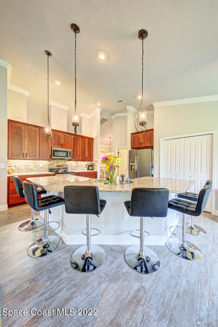 3945 Post Road Melbourne, FL 32934 - Photo 9 of 24 a living room with furniture and a floor to ceiling window