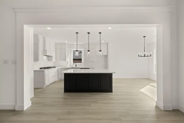 a view of kitchen with wooden floor