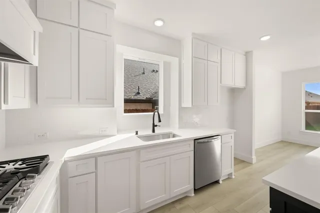 a bathroom with a double vanity sink mirror and