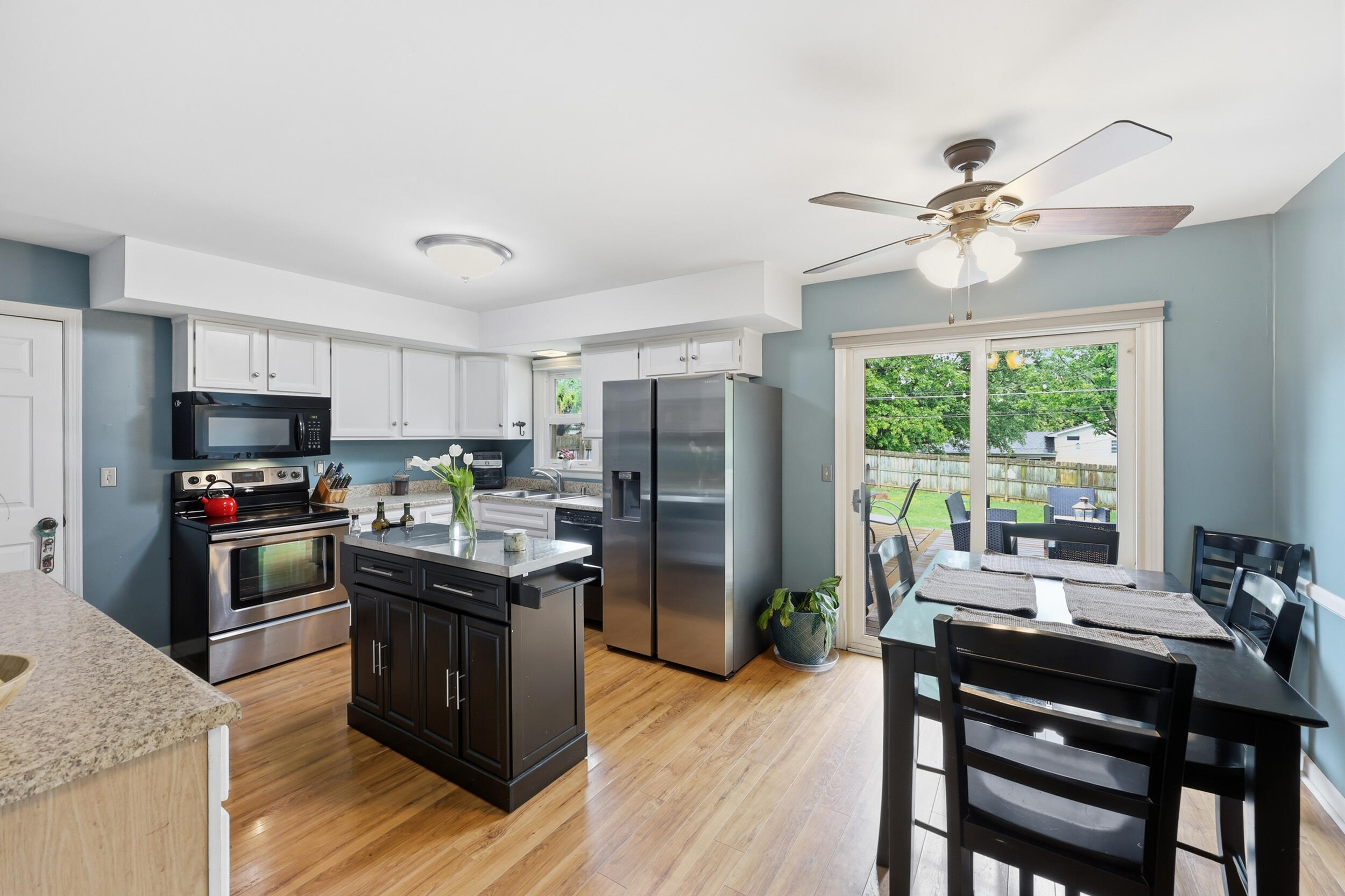 3308 Crown Crest Road Lexington, KY 40517 - Photo 7 of 29 Nice sized kitchen with hardwood floors and ceiling fan.