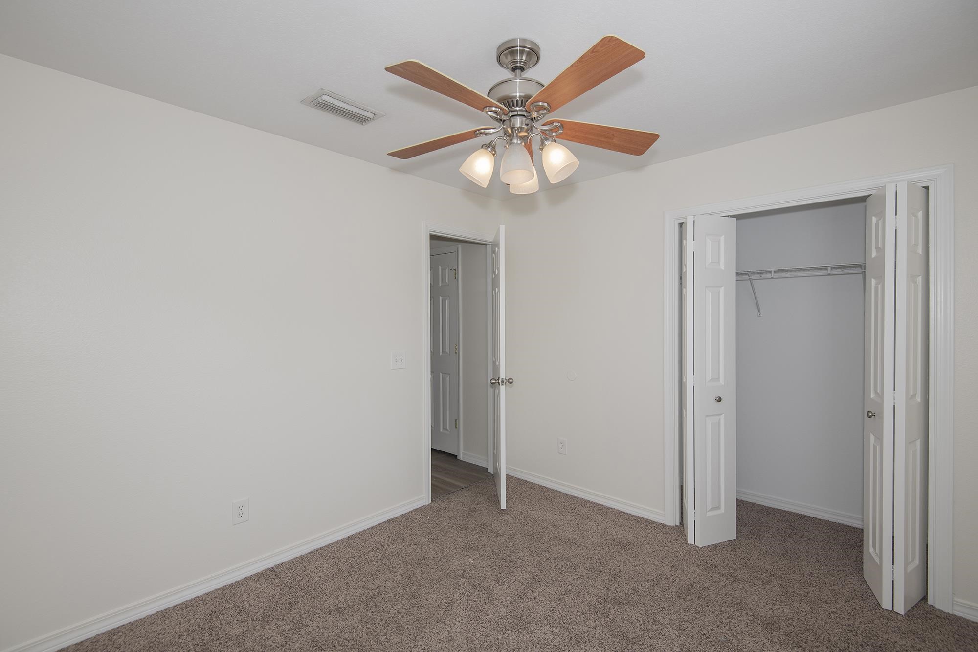 4608 Anna Simpson Road Milton, FL 32583 - Photo 19 of 22 an empty room with a fan and a fan