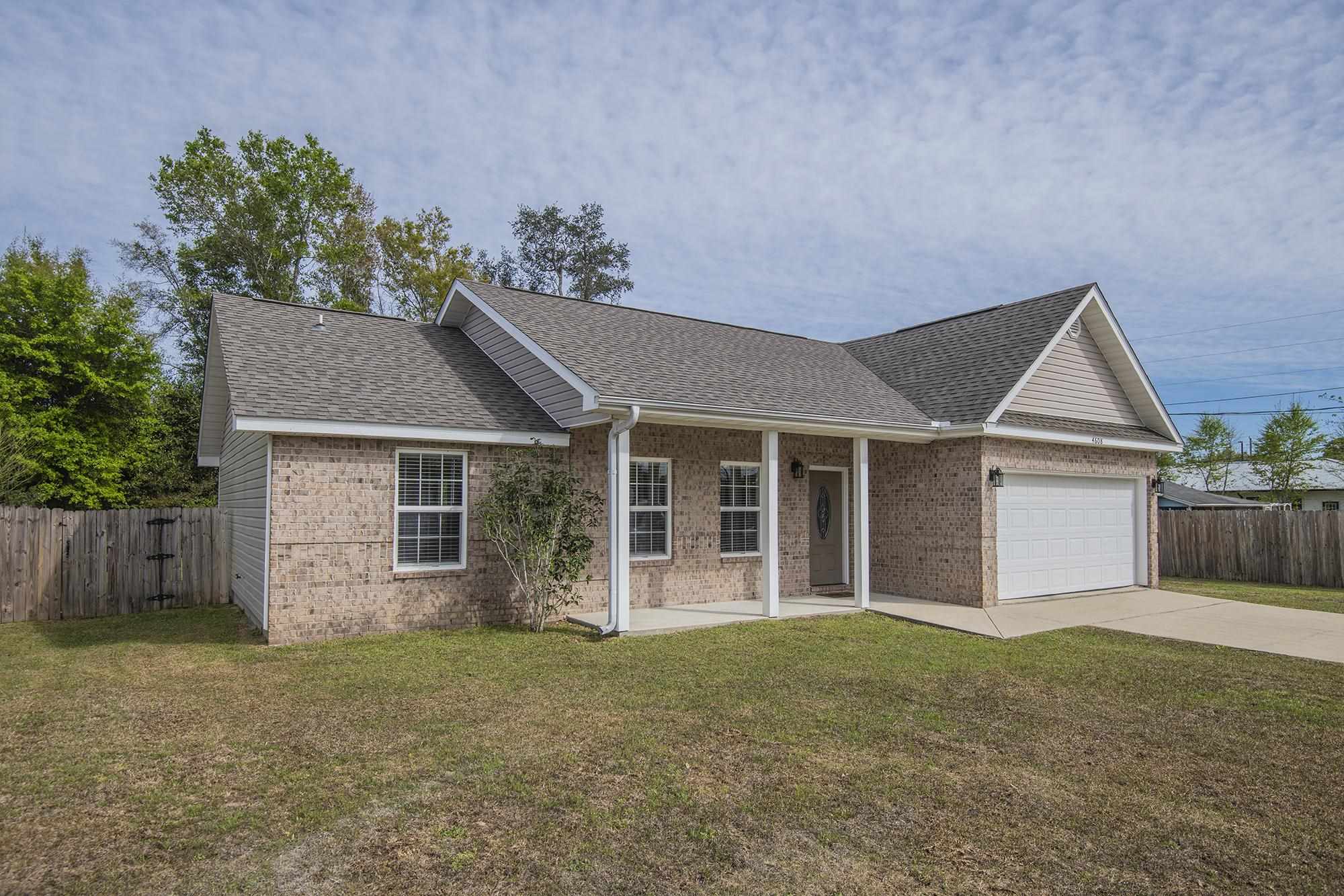 4608 Anna Simpson Road Milton, FL 32583 - Photo 2 of 22 front view of a house with a yard