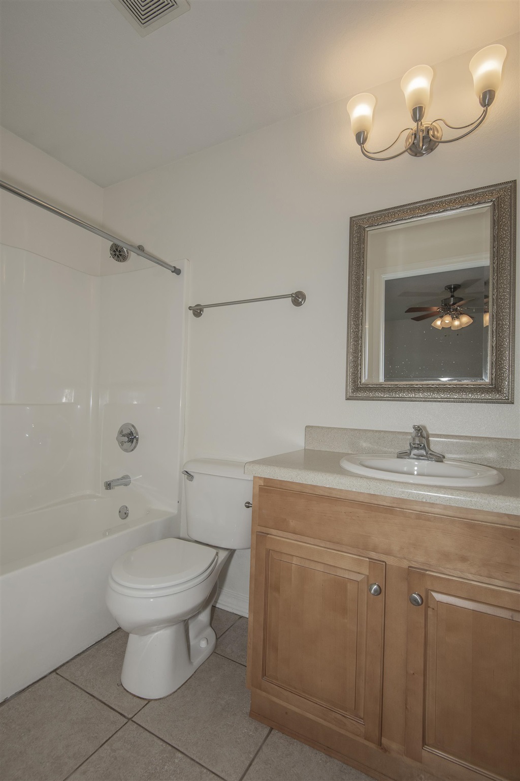 4608 Anna Simpson Road Milton, FL 32583 - Photo 22 of 22 a bathroom with a toilet sink and mirror