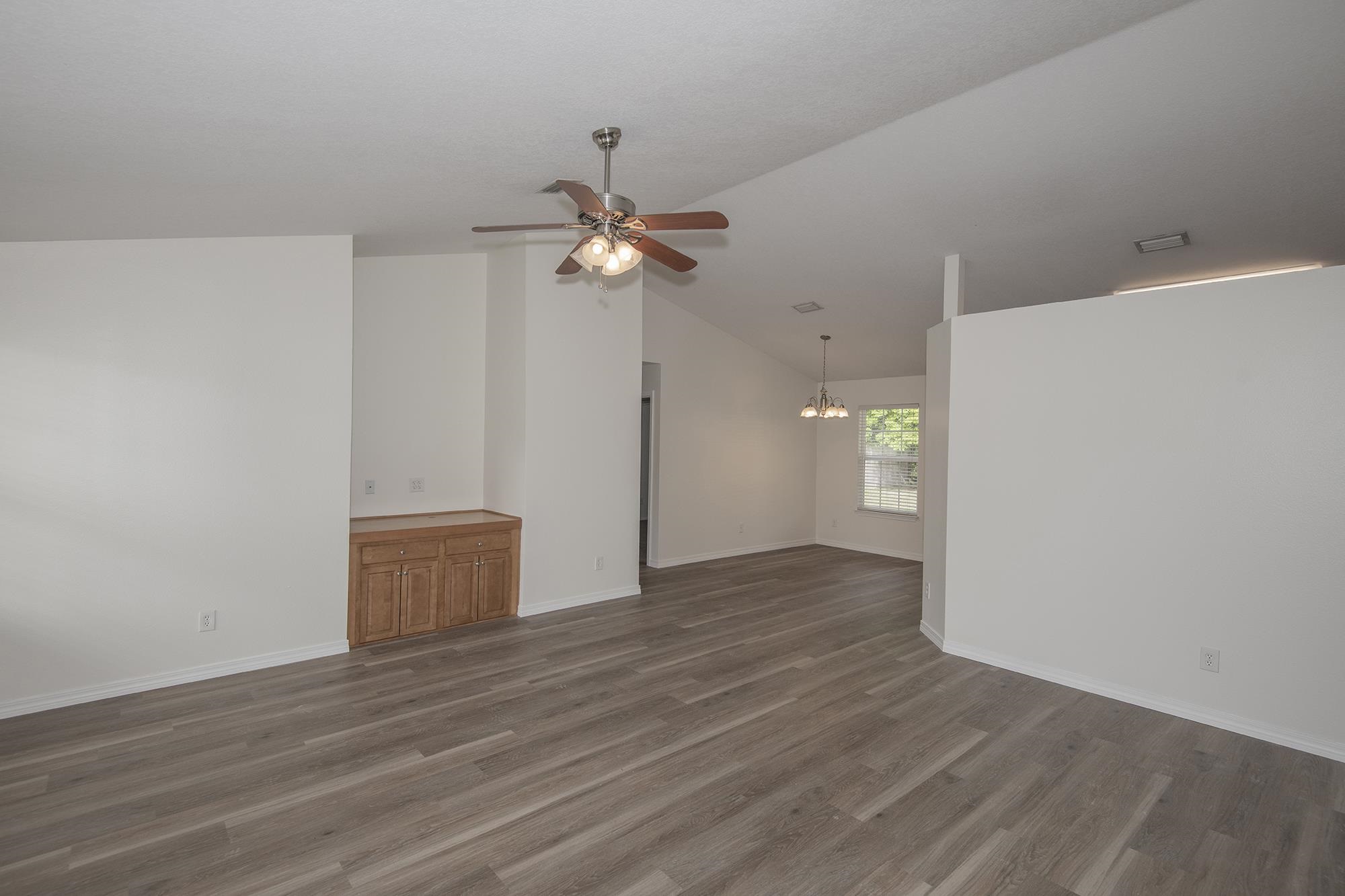 4608 Anna Simpson Road Milton, FL 32583 - Photo 4 of 22 wooden floor in an empty room