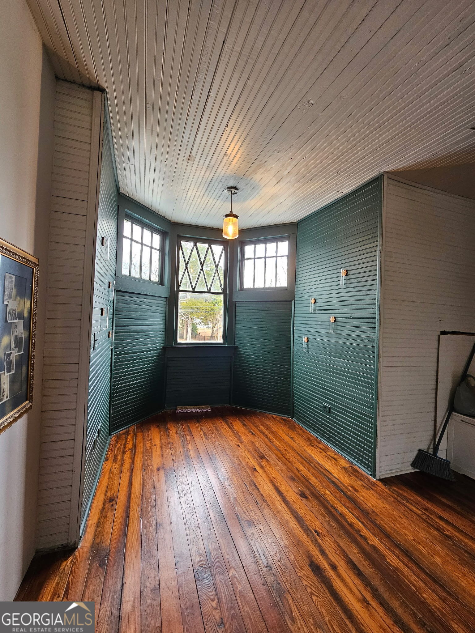 1907 Broad Street Statham, GA 30666 - Photo 15 of 20 a view of empty room with window and wooden floor