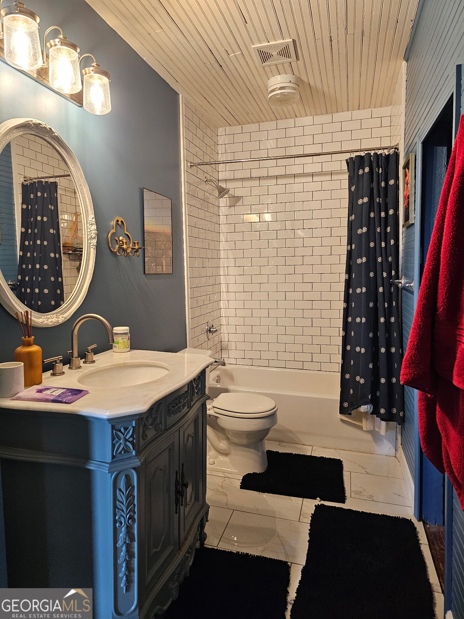 1907 Broad Street Statham, GA 30666 - Photo 17 of 20 a bathroom with a sink a toilet and shower