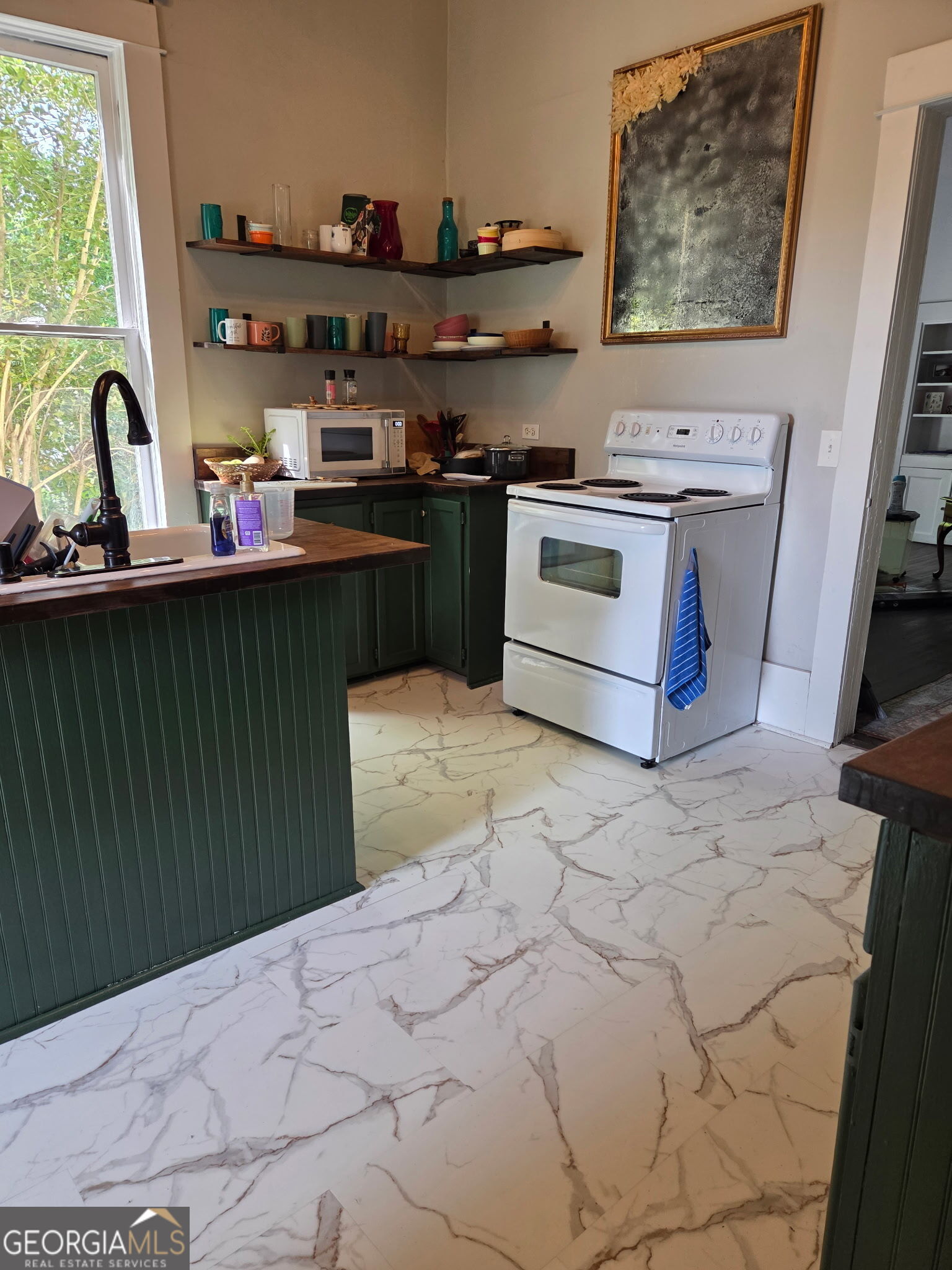 1907 Broad Street Statham, GA 30666 - Photo 7 of 20 a kitchen with a stove and a sink
