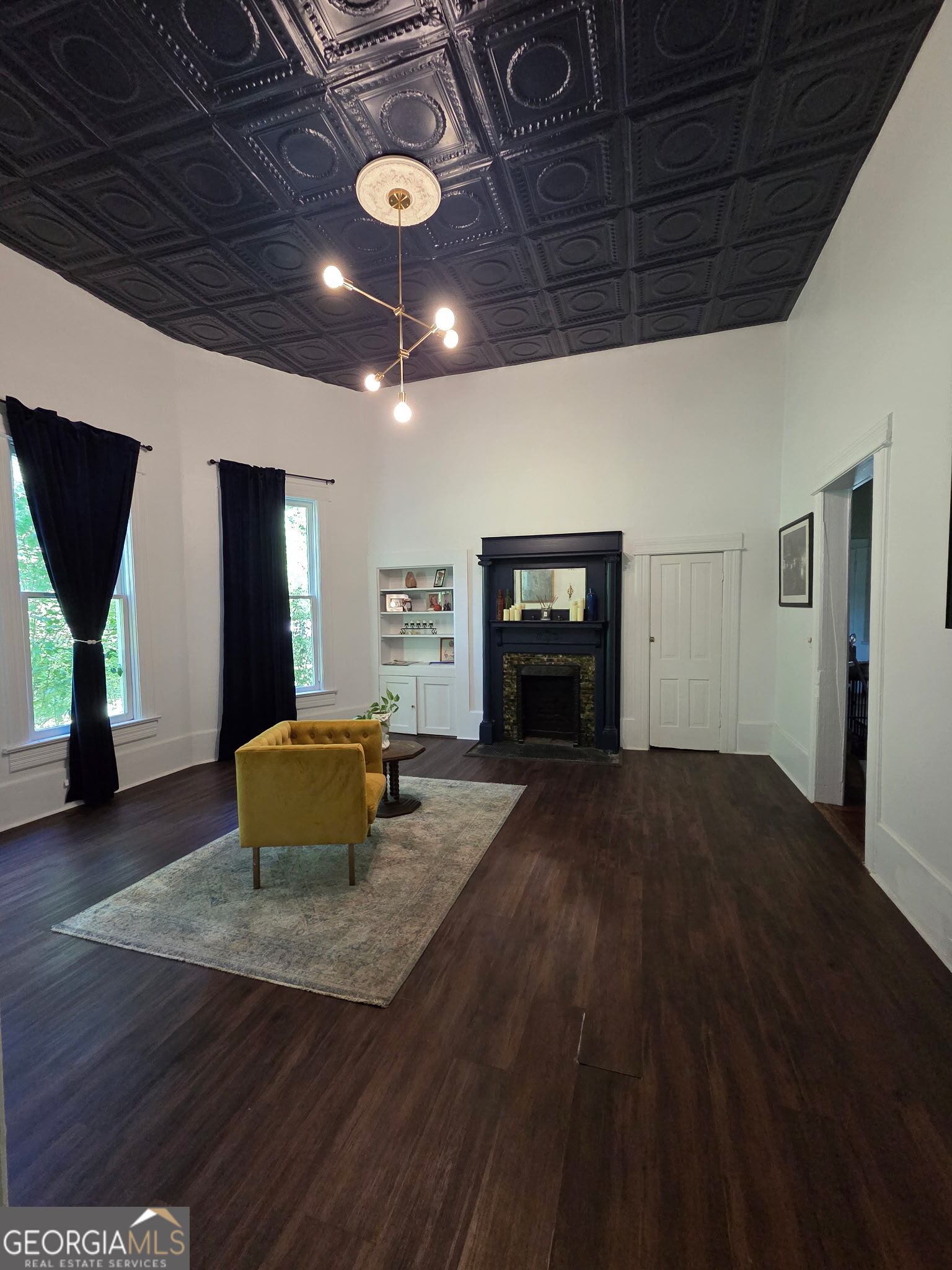 1907 Broad Street Statham, GA 30666 - Photo 9 of 20 a living room with furniture and a fireplace