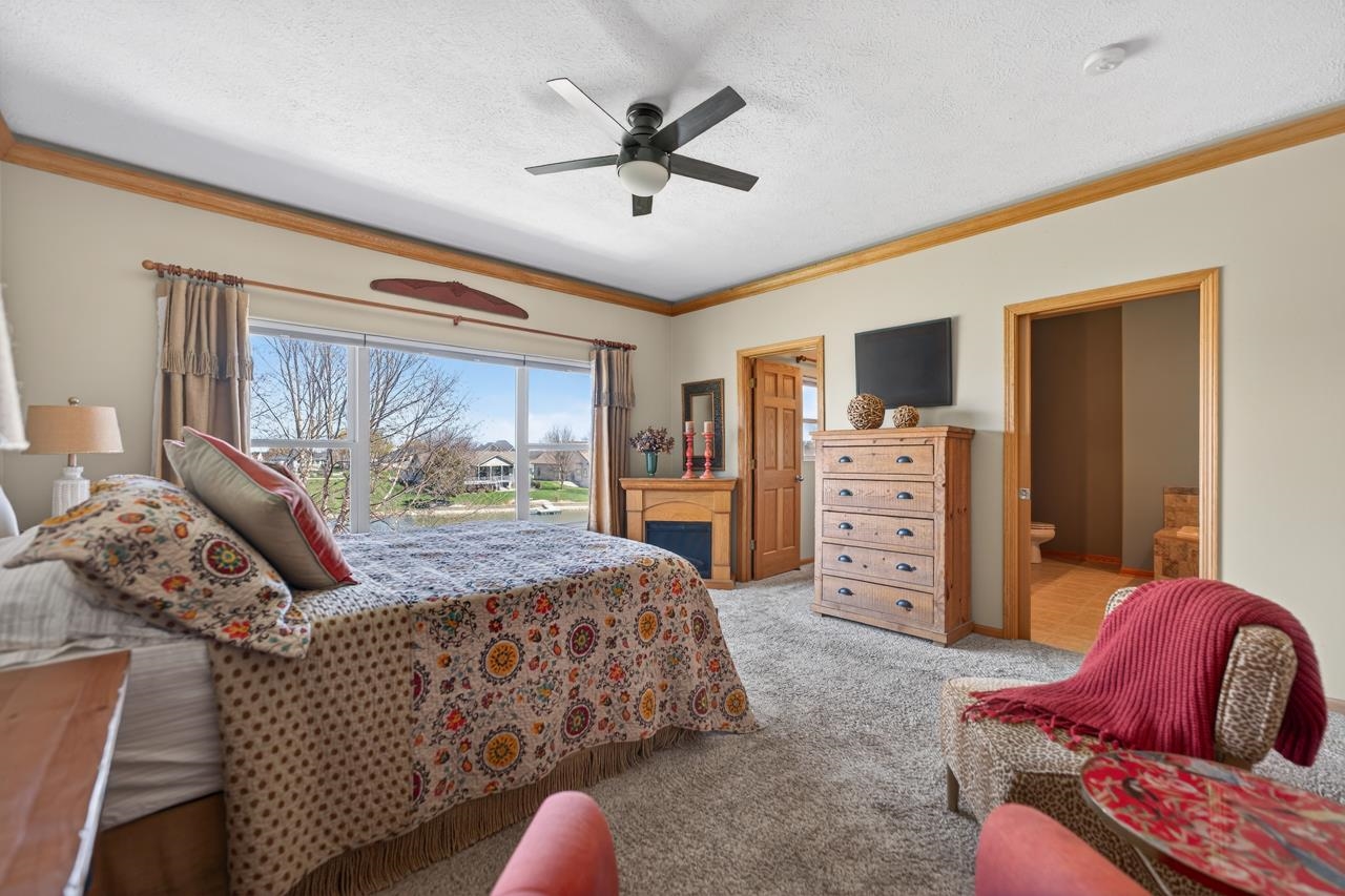 12805 Edgewater Pointe Winnebago, IL 61088 - Photo 20 of 47 a bedroom with a bed and furniture