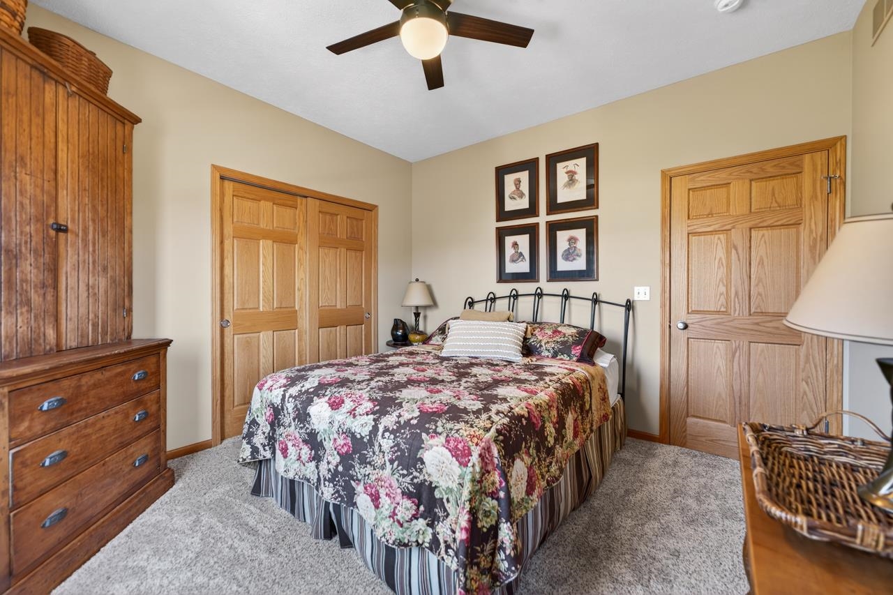 12805 Edgewater Pointe Winnebago, IL 61088 - Photo 25 of 47 a bedroom with a bed and a dresser