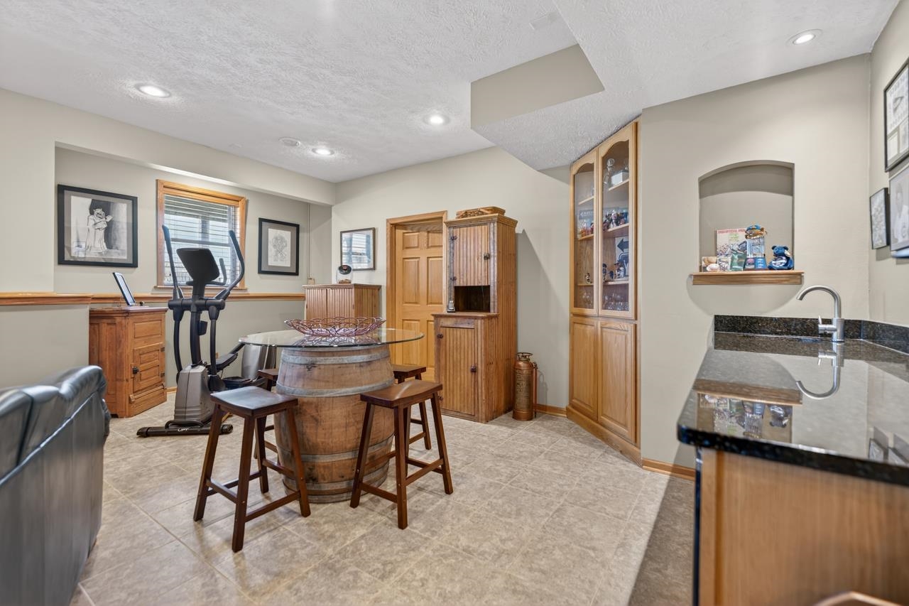 12805 Edgewater Pointe Winnebago, IL 61088 - Photo 27 of 47 a workspace with furniture and window
