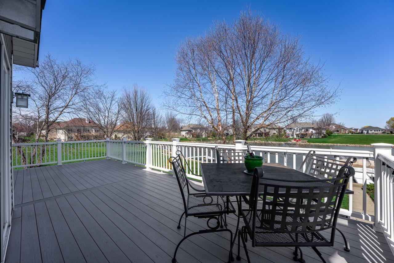 12805 Edgewater Pointe Winnebago, IL 61088 - Photo 32 of 47 a view of a chairs and table on the deck