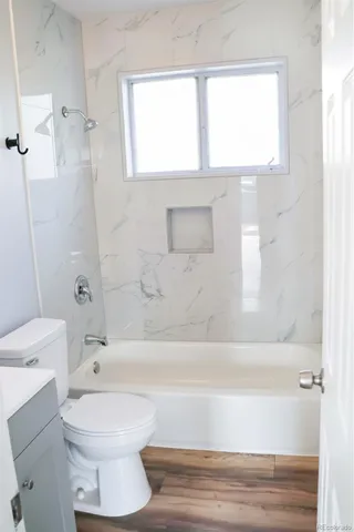 a bathroom with a toilet a sink and a bathtub