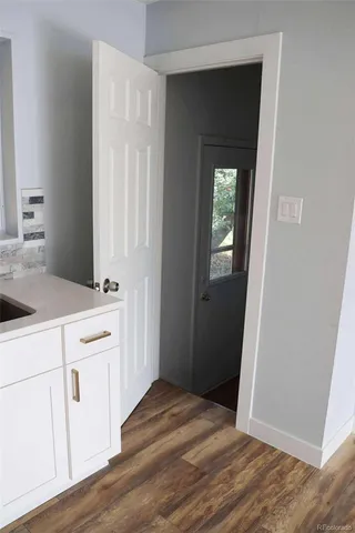 a view of a kitchen from the hallway