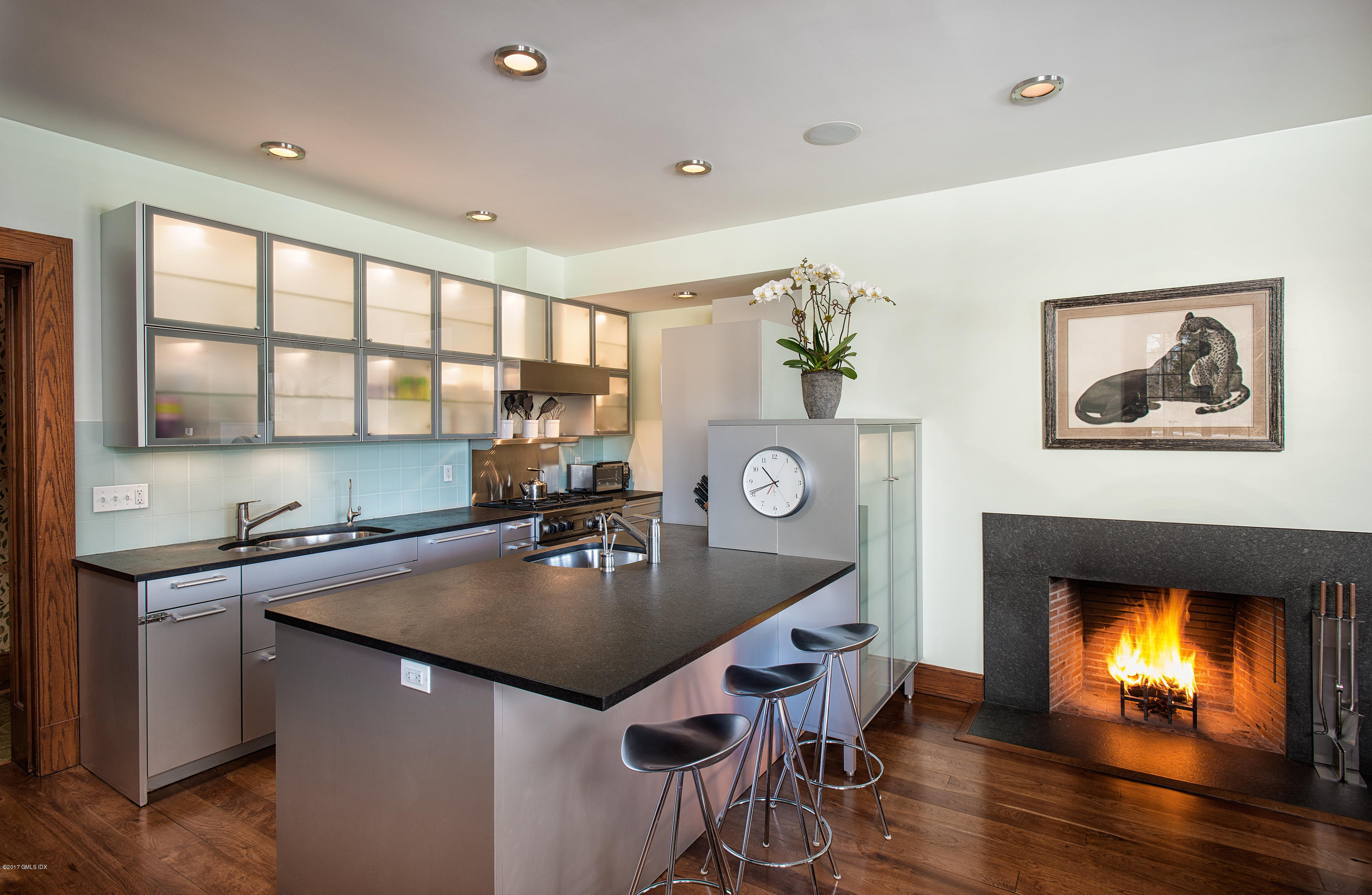 9 Sabine Farm Road Greenwich, CT 06831 - Photo 13 of 26 a kitchen with a table chairs and living room