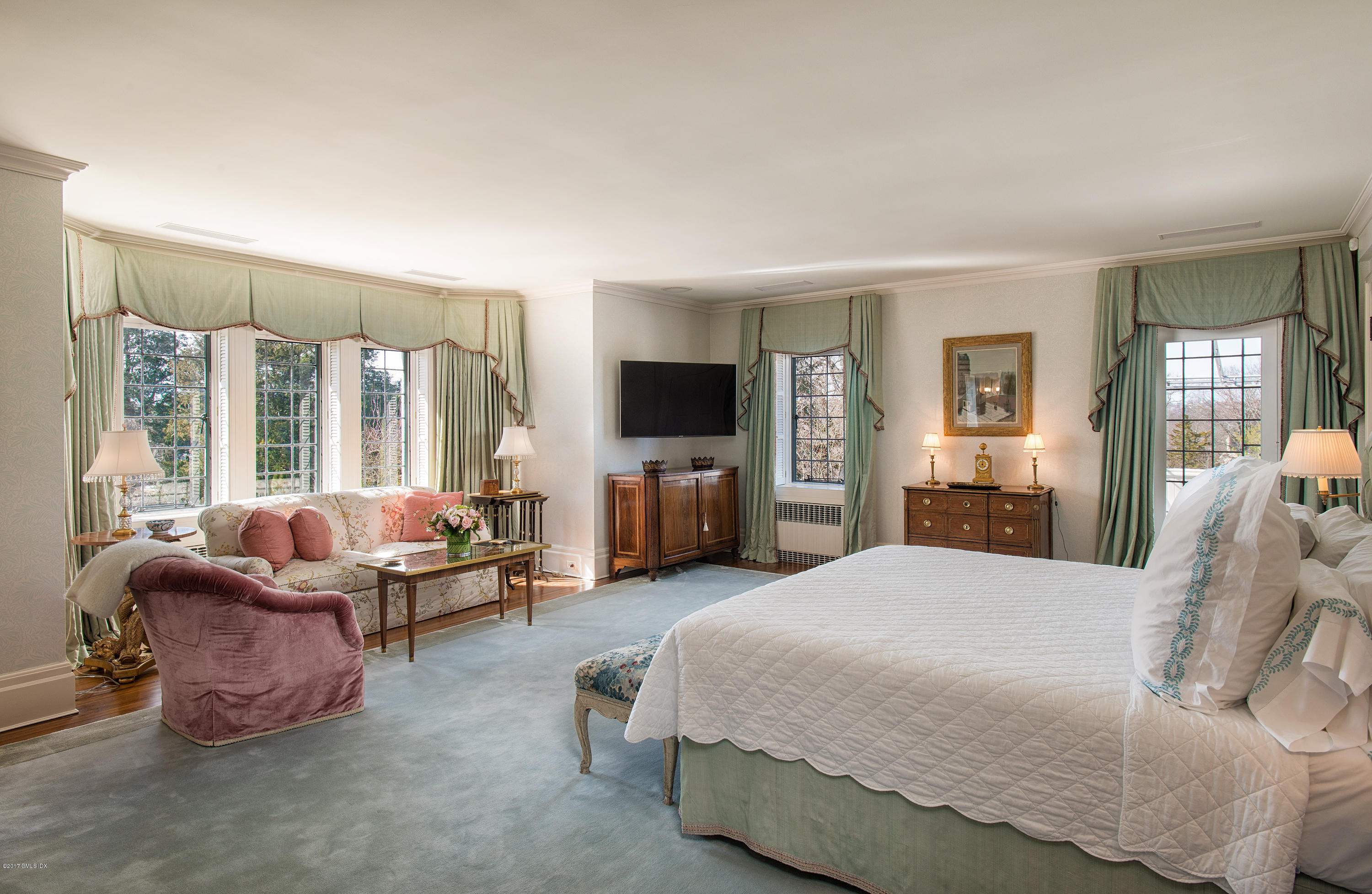 9 Sabine Farm Road Greenwich, CT 06831 - Photo 15 of 26 a spacious bedroom with a bed and large windows