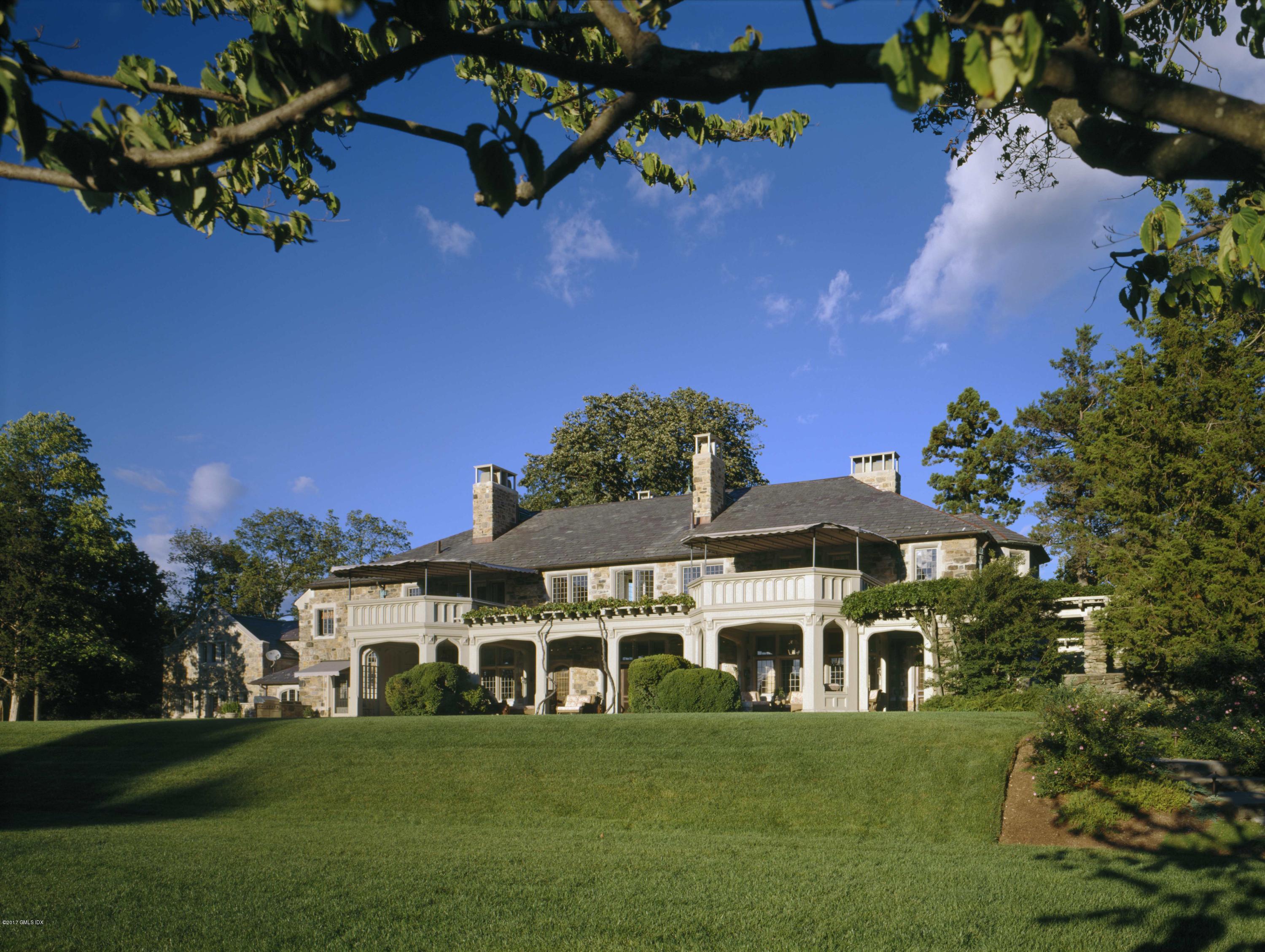 9 Sabine Farm Road Greenwich, CT 06831 - Photo 19 of 26 a front view of a house with a garden