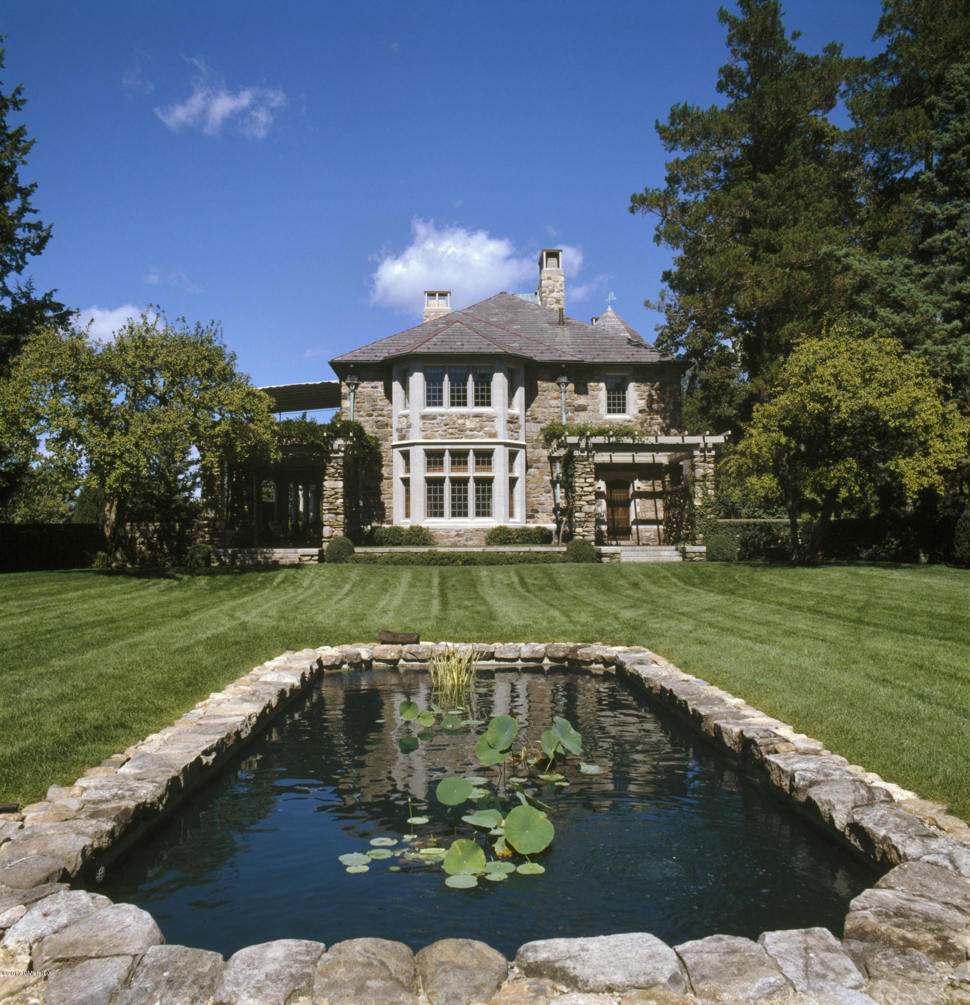 9 Sabine Farm Road Greenwich, CT 06831 - Photo 21 of 26 a view of a house with a yard