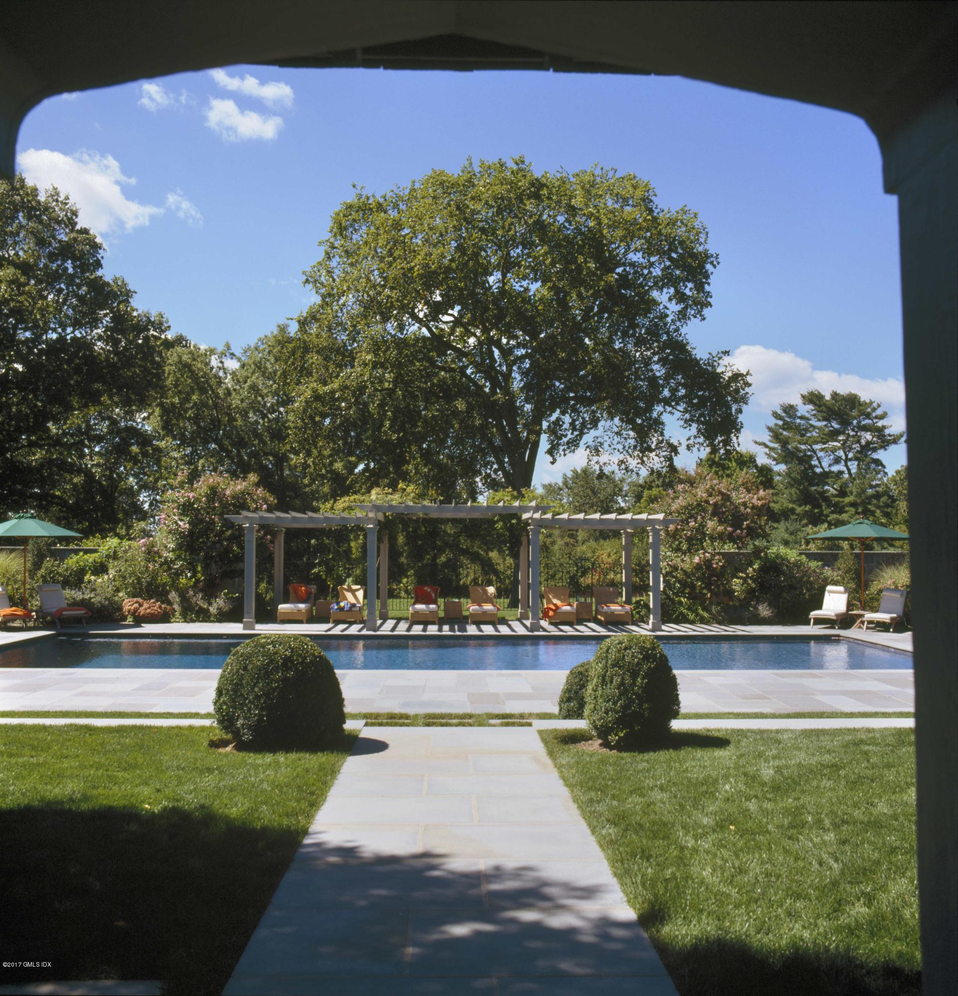 9 Sabine Farm Road Greenwich, CT 06831 - Photo 23 of 26 a view of a swimming pool with a patio