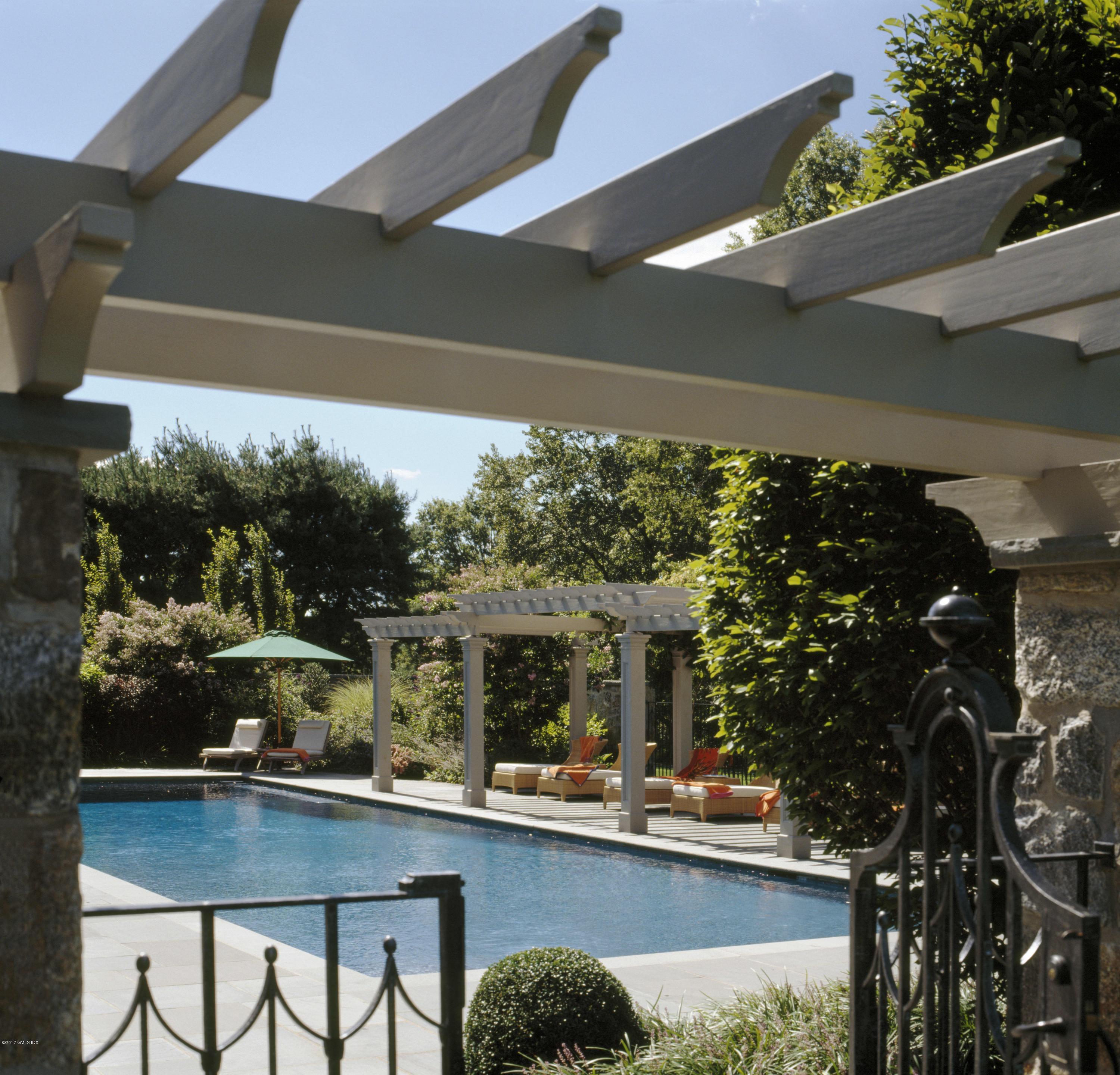 9 Sabine Farm Road Greenwich, CT 06831 - Photo 24 of 26 a view of a chairs and table in a balcony