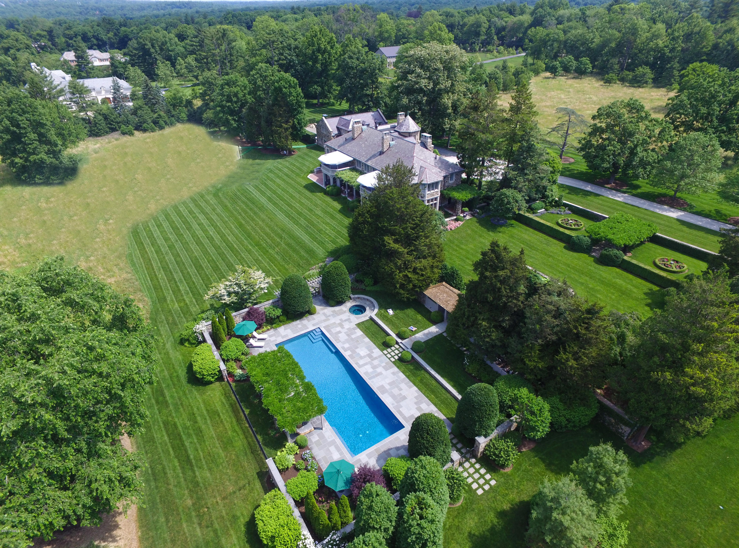 9 Sabine Farm Road Greenwich, CT 06831 - Photo 25 of 26 an aerial view of green landscape with trees houses and lake view
