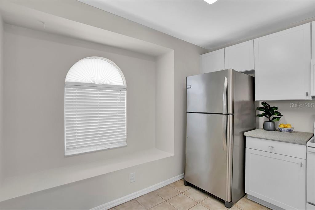 1706 Erin Brooke Drive Valrico, FL 33594 - Photo 11 of 39 a white refrigerator freezer and a dishwasher in a kitchen
