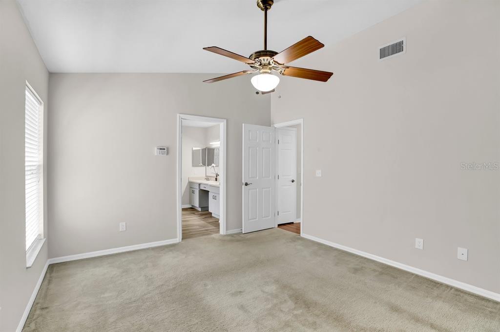 1706 Erin Brooke Drive Valrico, FL 33594 - Photo 13 of 39 a view of a livingroom with a chandelier fan and a window