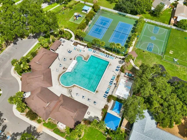 an aerial view of a house with outdoor space