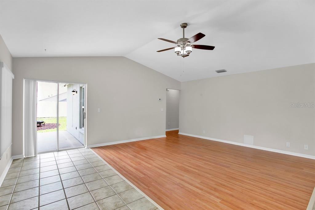 1706 Erin Brooke Drive Valrico, FL 33594 - Photo 3 of 39 a view of empty room with wooden floor