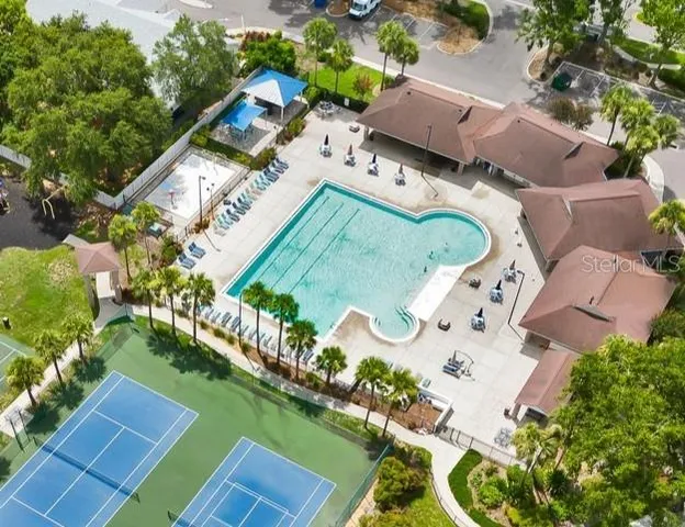 an aerial view of a house with a swimming pool