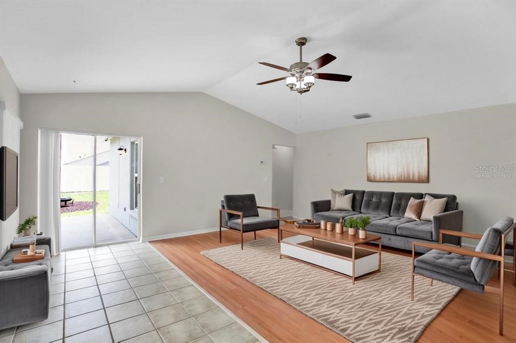 1706 Erin Brooke Drive Valrico, FL 33594 - Photo 4 of 39 a living room with furniture and a flat screen tv