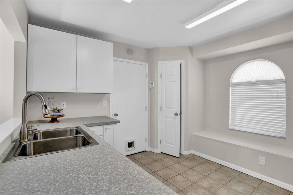 1706 Erin Brooke Drive Valrico, FL 33594 - Photo 9 of 39 a kitchen that has a stove and a sink