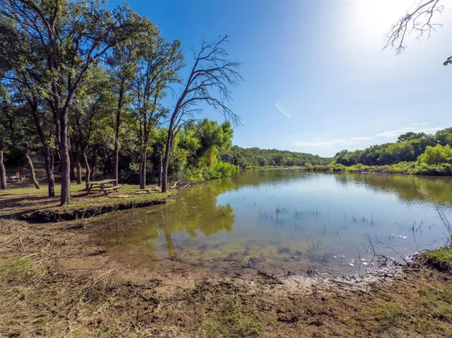 a view of a lake with a house in the background