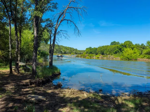 a view of a lake with a yard