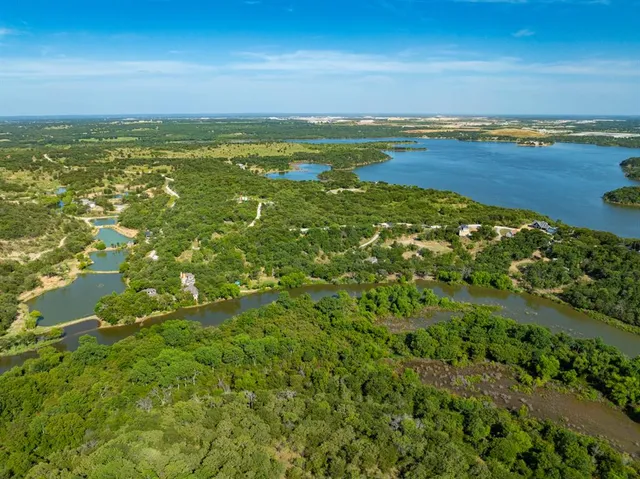 a view of a lake with a yard