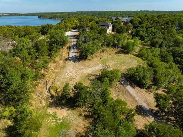 a view of a yard with a lake view