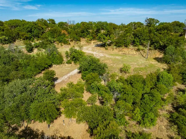 a view of a garden with a building