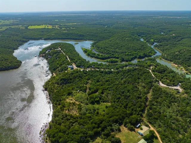 a view of a field with an ocean