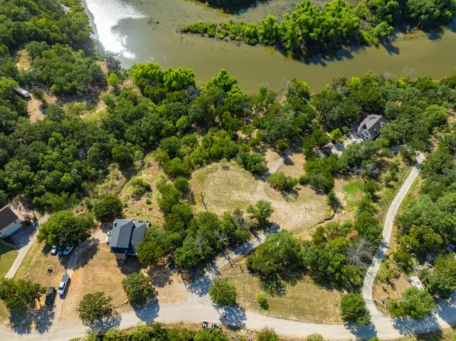 a street sign that is on a tree