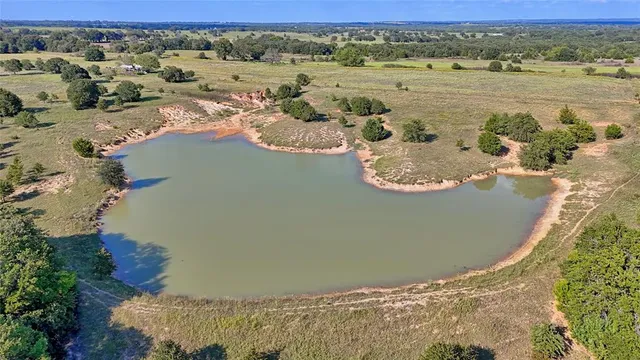 a view of a field with an outdoor space