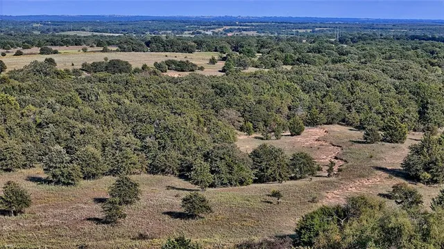 a view of a lake with houses in the back