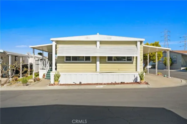 a view of a building with car parked