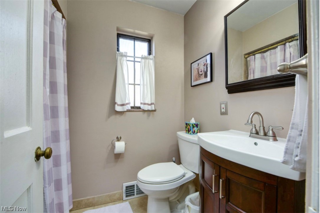 15902 Munn Road Cleveland, OH 44111 - Photo 8 of 27 Bathroom featuring vanity, and toilet