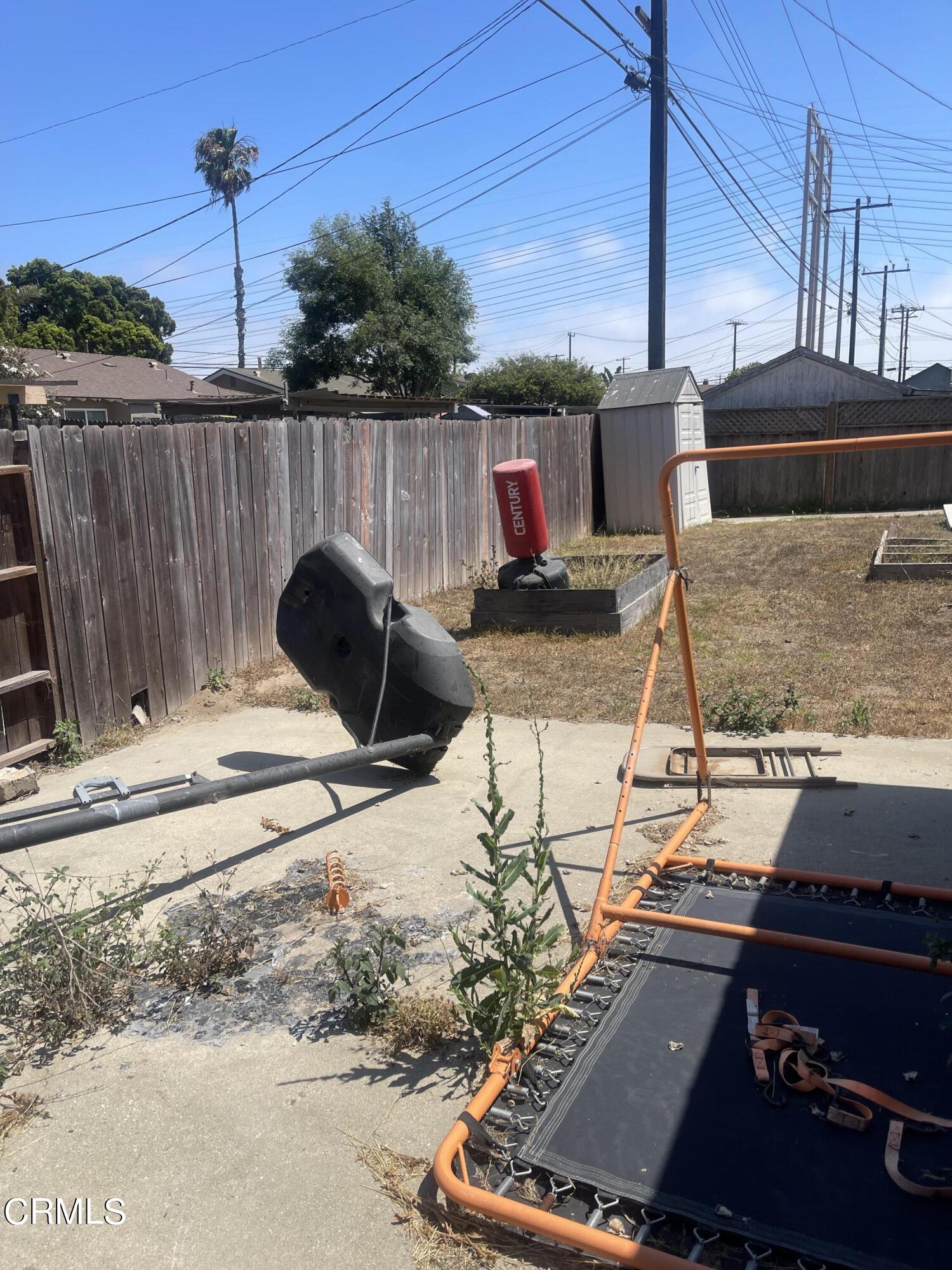 4900 Reeder Avenue Oxnard, CA 93033 - Photo 8 of 13 a view of a balcony with chairs and wooden floor
