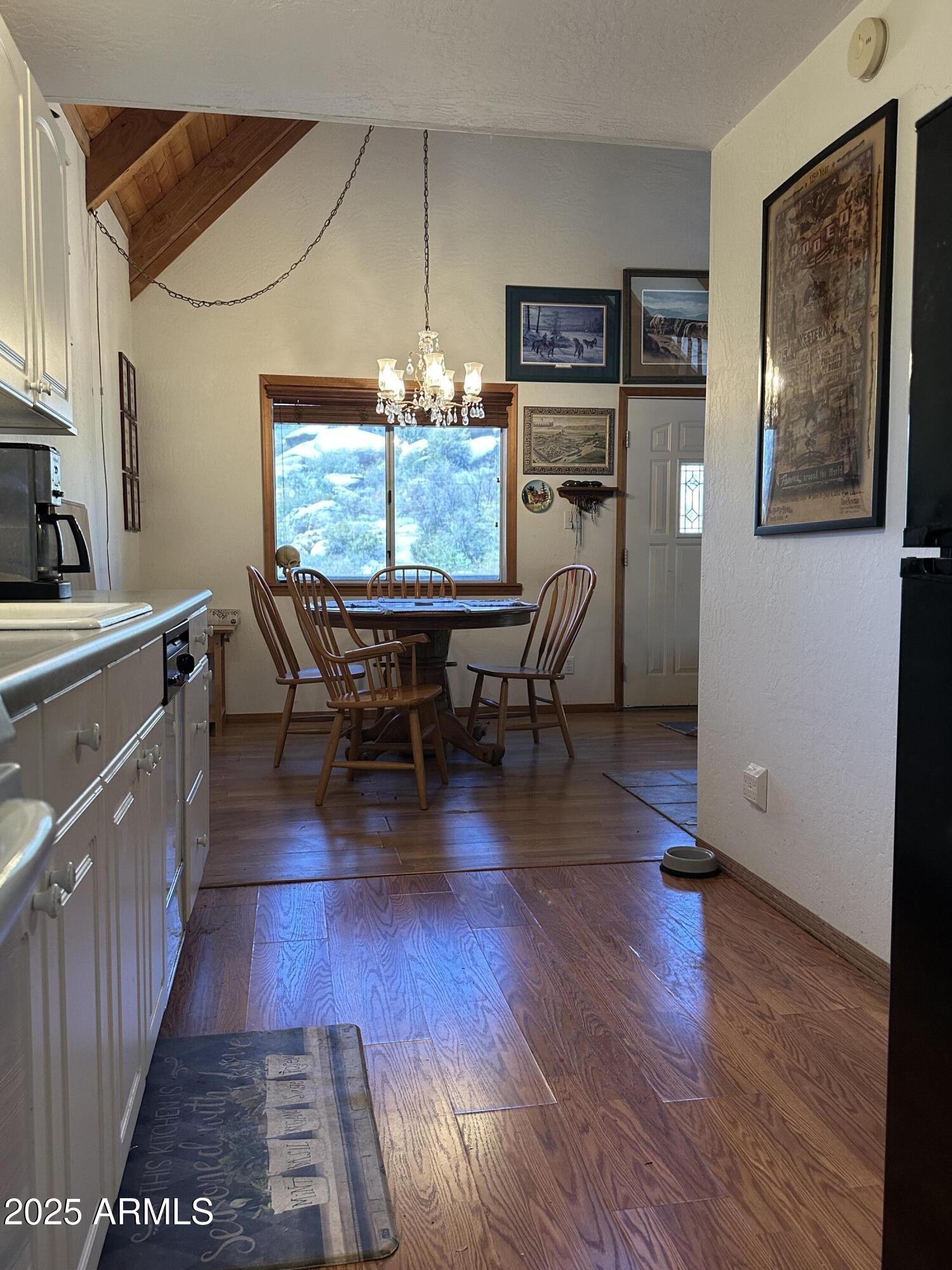 16947 Willow Avenue Yarnell, AZ 85362 - Photo 14 of 44 a view of a dining room with furniture window and wooden floor